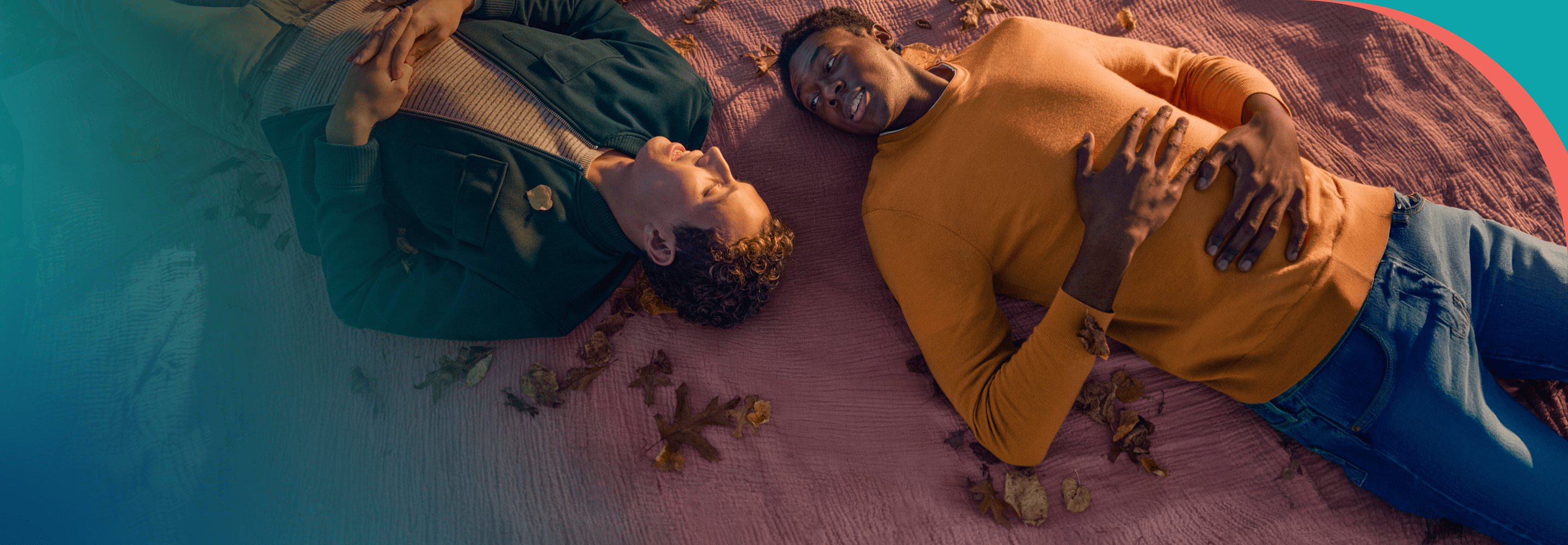 Male couple laying down speaking.