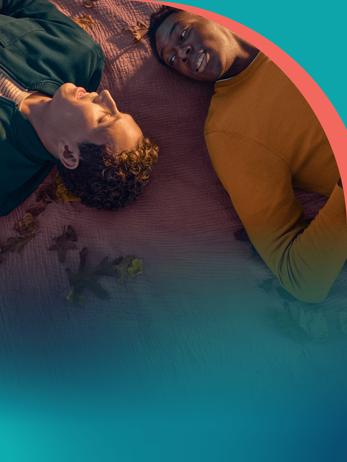 Male couple laying down speaking.