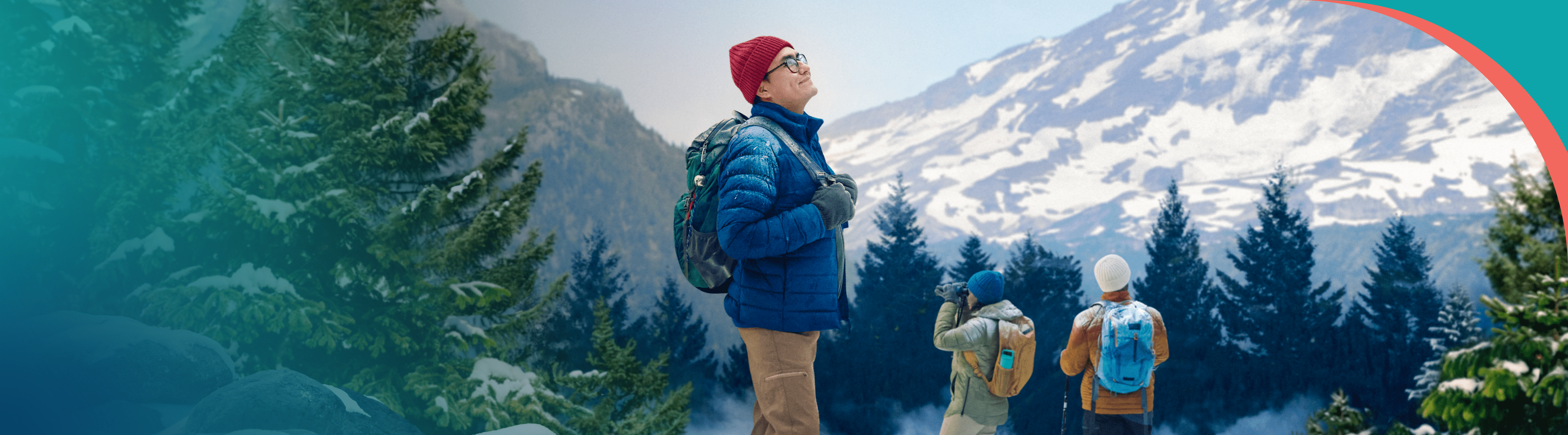 A group of friends are standing on a peak staring at a mountain.