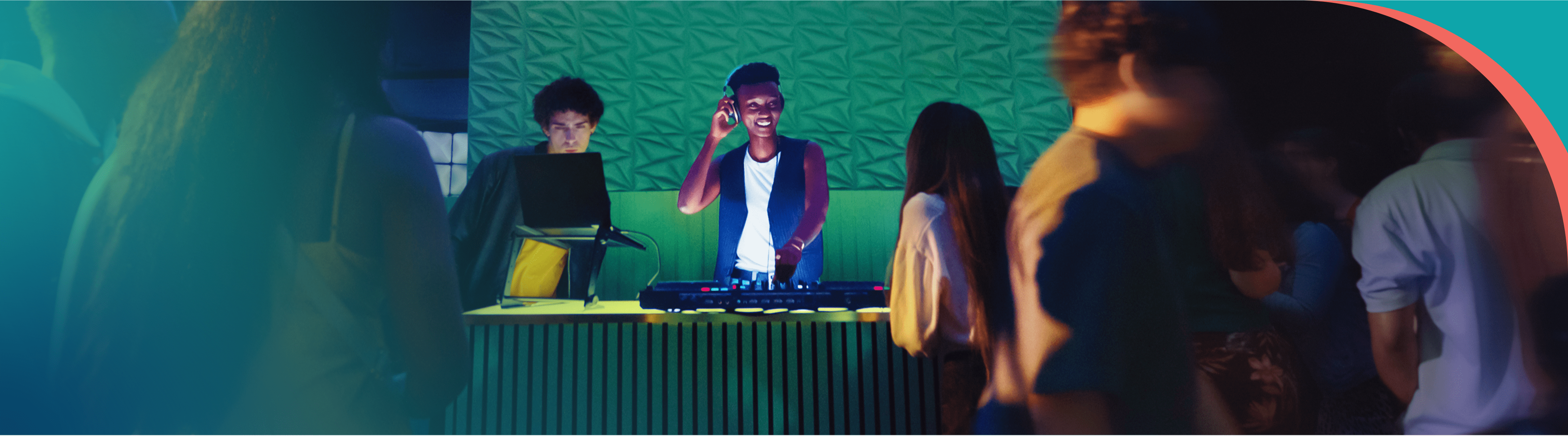 A female DJ is smiling playing music in a club