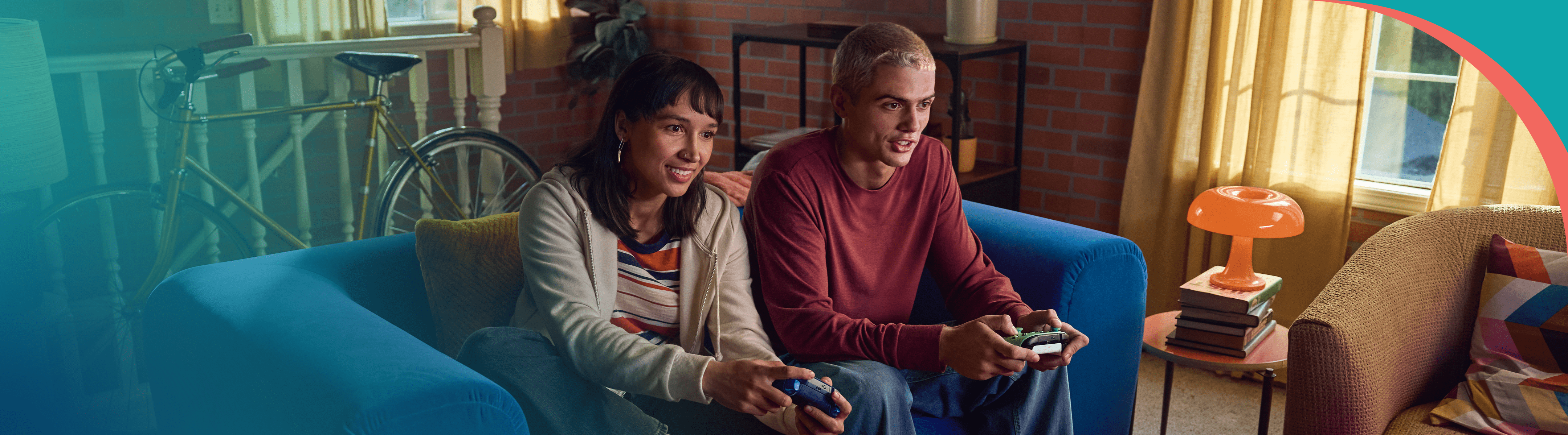 A couple is sitting on a couch playing video games.