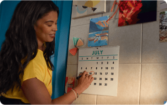 Woman circling a date on a calander