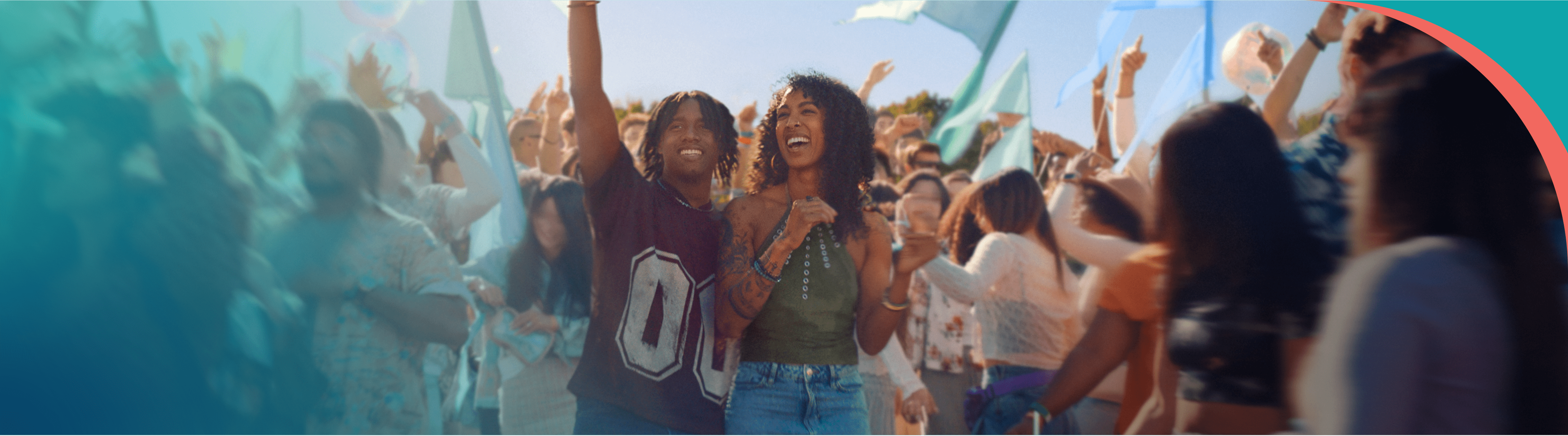 A couple is smiling in a crowd at a concert.